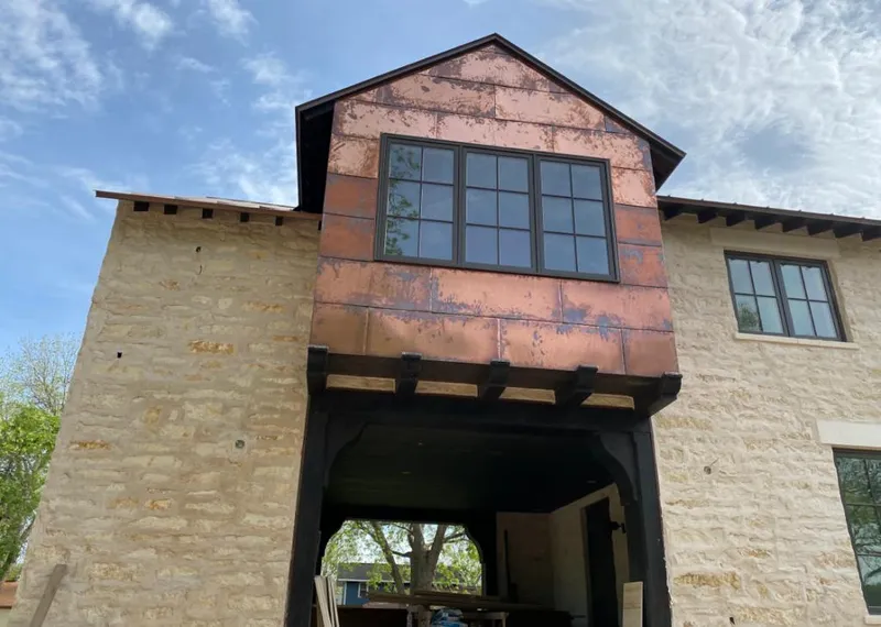Copper metal panel facade on a stone building for Metal Roof Coating in Black Mountain