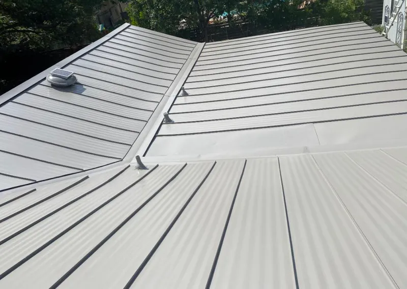 Solar attic fan installed on a metal roof for Roof Ventilation in Black Mountain